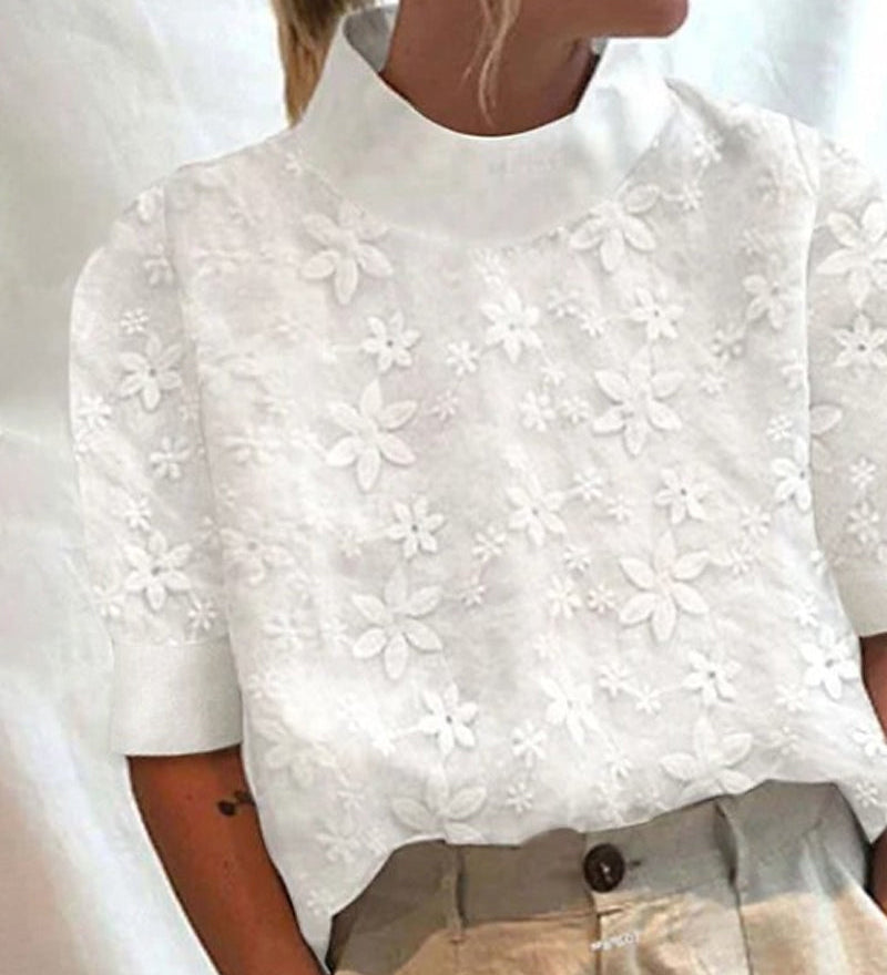 Bluse mit besticktem einfarbigem Stehkragen
